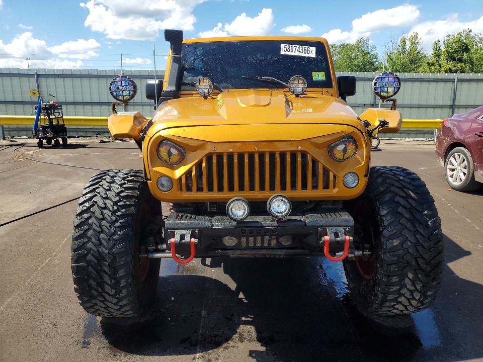 2014 Jeep Wrangler unlimited VIN 1C4BJWDG1EL276774 COPART salvage auction — MINOR DENT/SCRATCHES, Mi - Cert Of Title-Rebuilt Salvage, sold $6,800 on 2026-07-02 (photo 5)