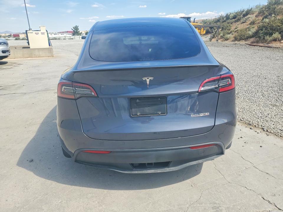2023 Tesla Model y VIN 7SAYGDEF9PF711908 COPART salvage auction — SIDE, Nv - Salvage Title, sold $10,700 on 2026-07-06 (photo 6)