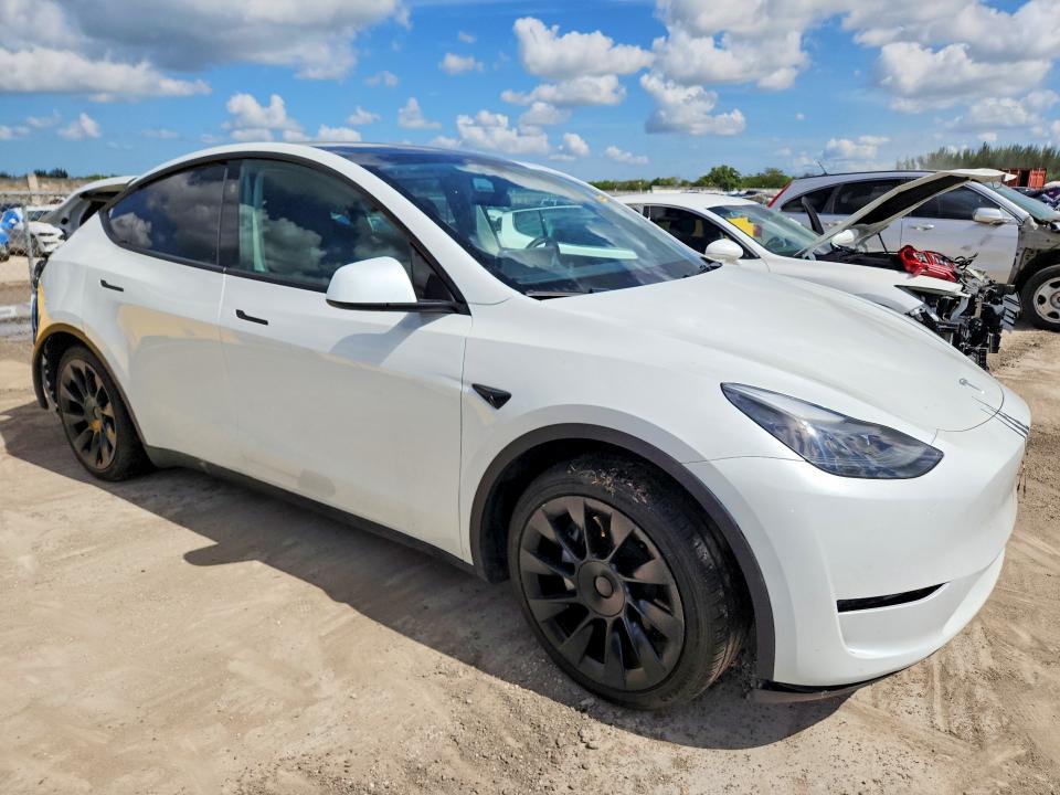 2024 Tesla Model y VIN 7SAYGDED0RF041831 COPART salvage auction — REAR END, Fl - Cert Of Title Slvg Rebuildable, sold $7,700 on 2026-07-15 (photo 4)