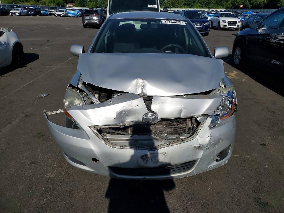 2010 Toyota Yaris VIN JTDBT4K36A1360982 COPART salvage auction — FRONT END, Or - Salvage Title Certificate, sold $125 on 2026-07-29 (photo 5)