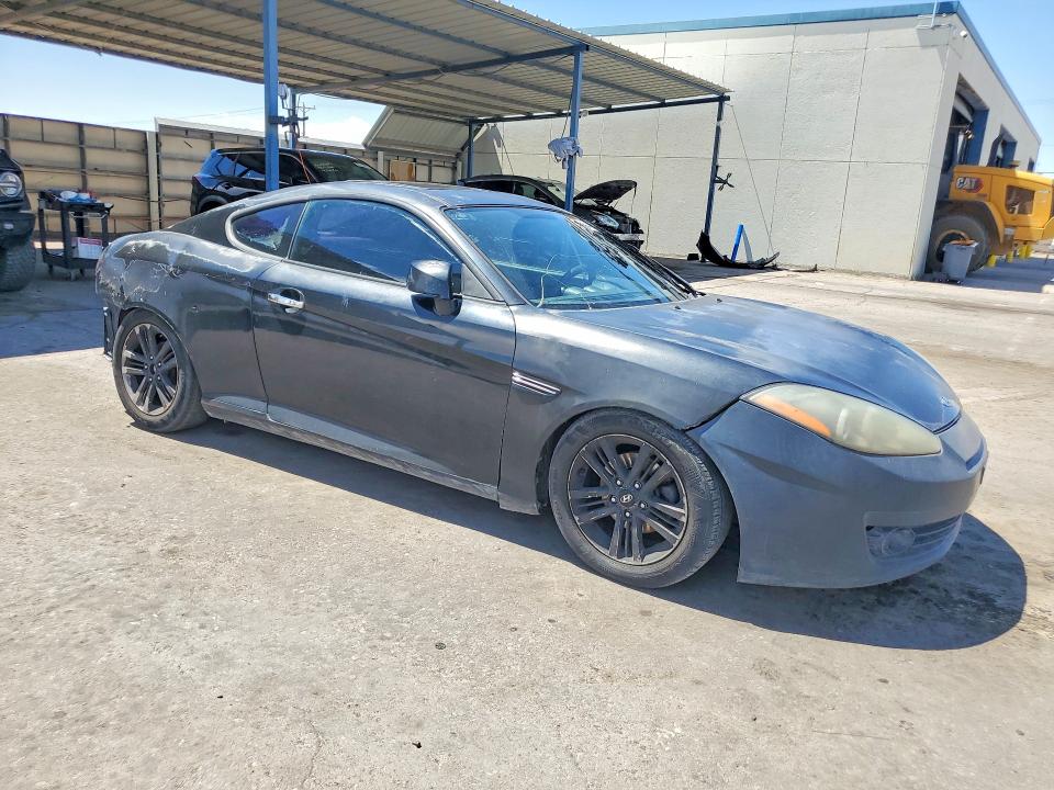 2007 Hyundai Tiburon VIN KMHHM66D17U243934 COPART salvage auction — FRONT END, Tx - Salvage Vehicle Title, sold $275 on 2026-07-10 (photo 4)