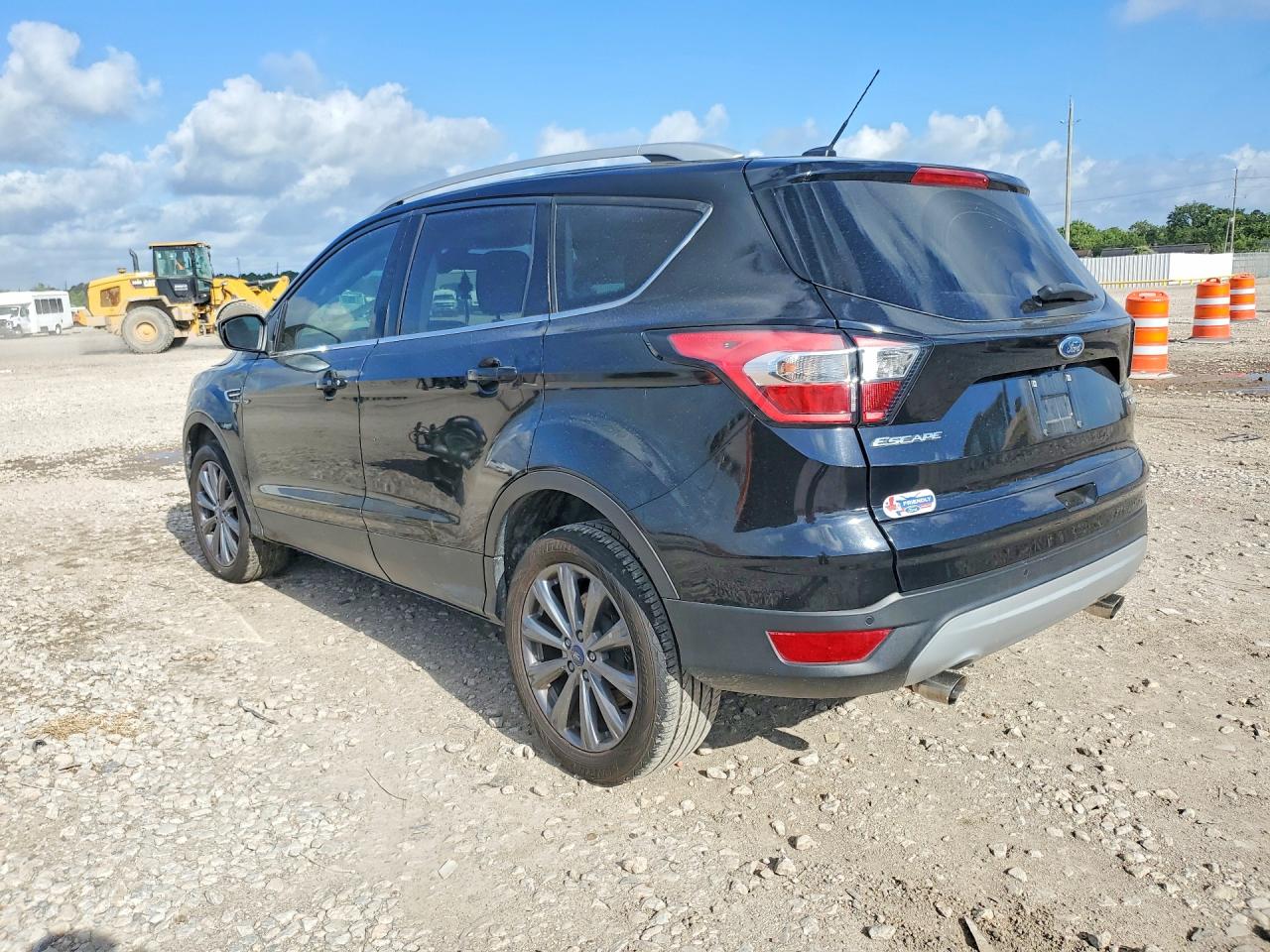 2017 Ford Escape VIN 1FMCU0J98HUD84298 COPART salvage auction — Side, TX - SALVAGE VEHICLE TITLE, sold $2,300 on 2026-07-02 (photo 2)