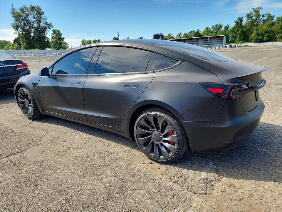 2022 Tesla Model 3 VIN 5YJ3E1EC7NF129773 COPART salvage auction — SIDE, Or - Salvage Title Certificate, sold $1,050 on 2026-07-29 (photo 2)