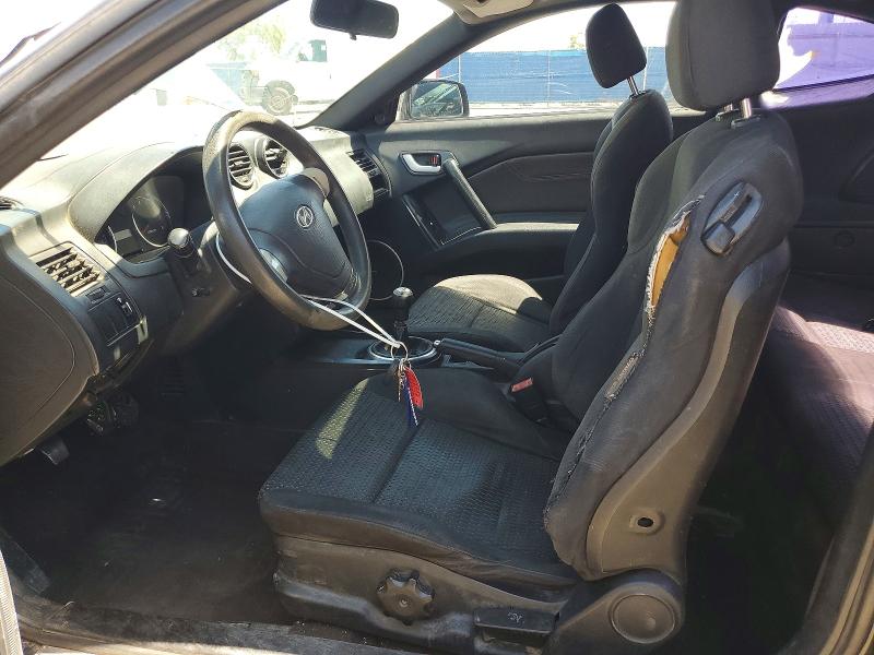 2007 Hyundai Tiburon VIN KMHHM66D17U243934 COPART salvage auction — FRONT END, Tx - Salvage Vehicle Title, sold $275 on 2026-07-10 (photo 7)