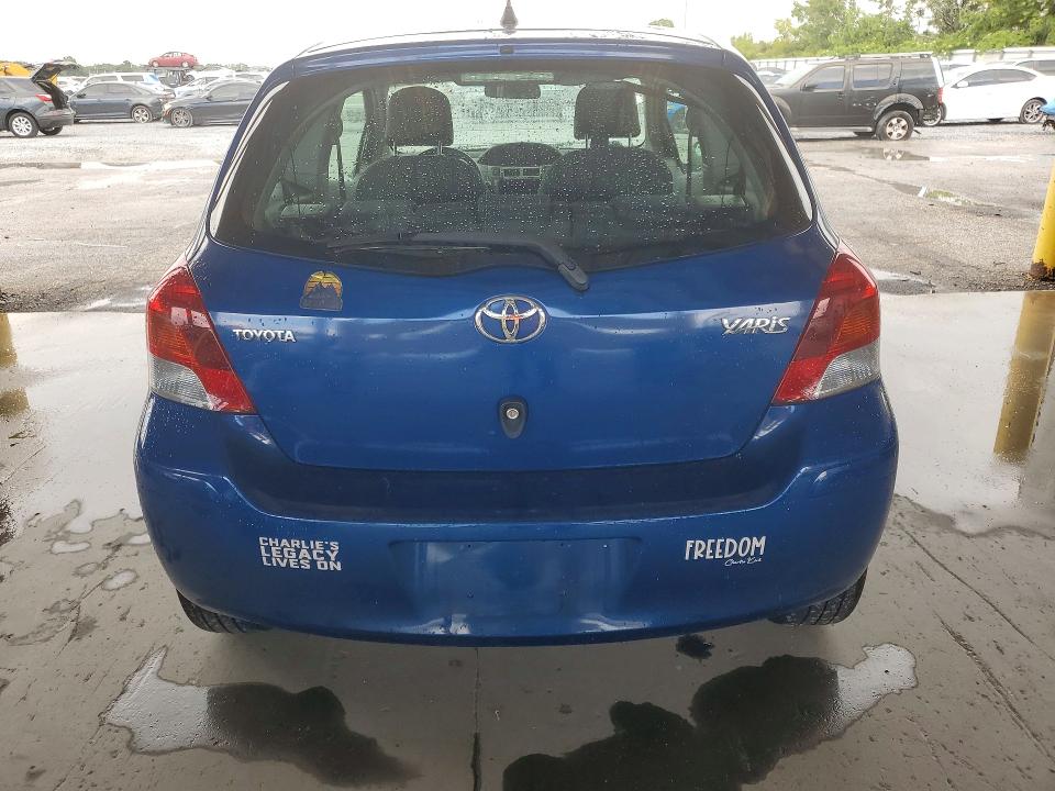 2010 Toyota Yaris VIN JTDJT4K33A5288689 COPART salvage auction — SIDE, Fl - Cert Of Title Slvg Rebuildable, sold $850 on 2026-07-06 (photo 6)