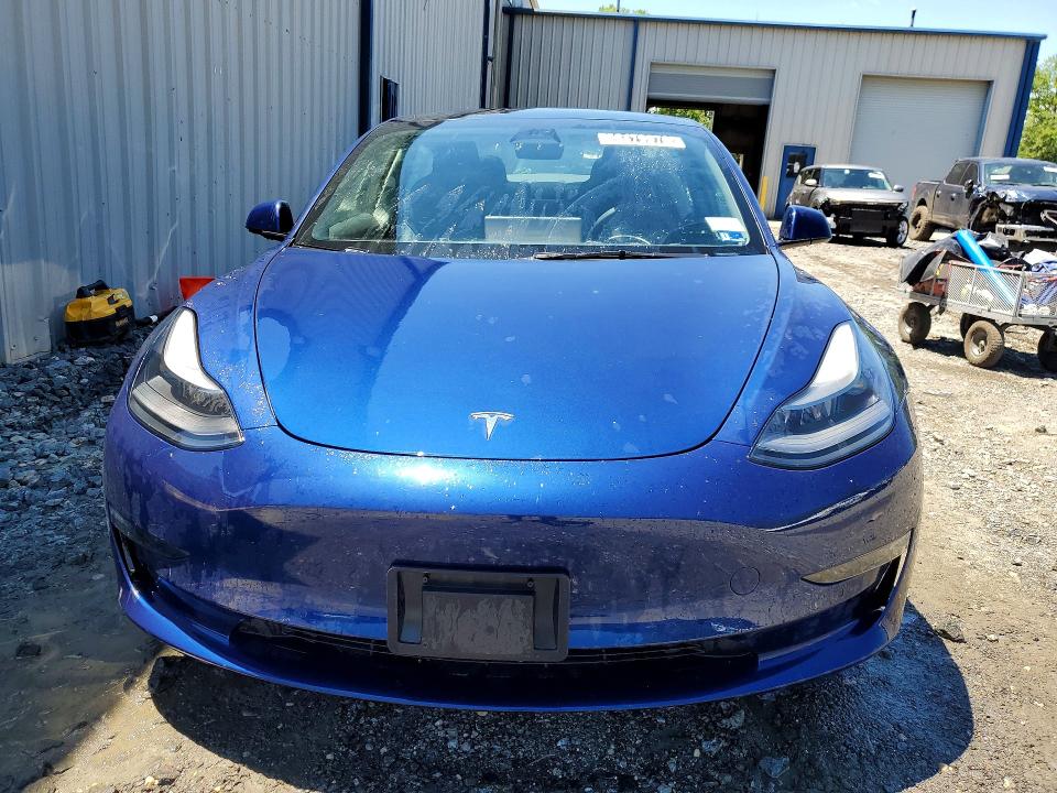 2022 Tesla Model 3 VIN 5YJ3E1EA1NF370131 COPART salvage auction — SIDE, Ny - Certificate Of Title, sold $14,200 on 2026-07-13 (photo 5)