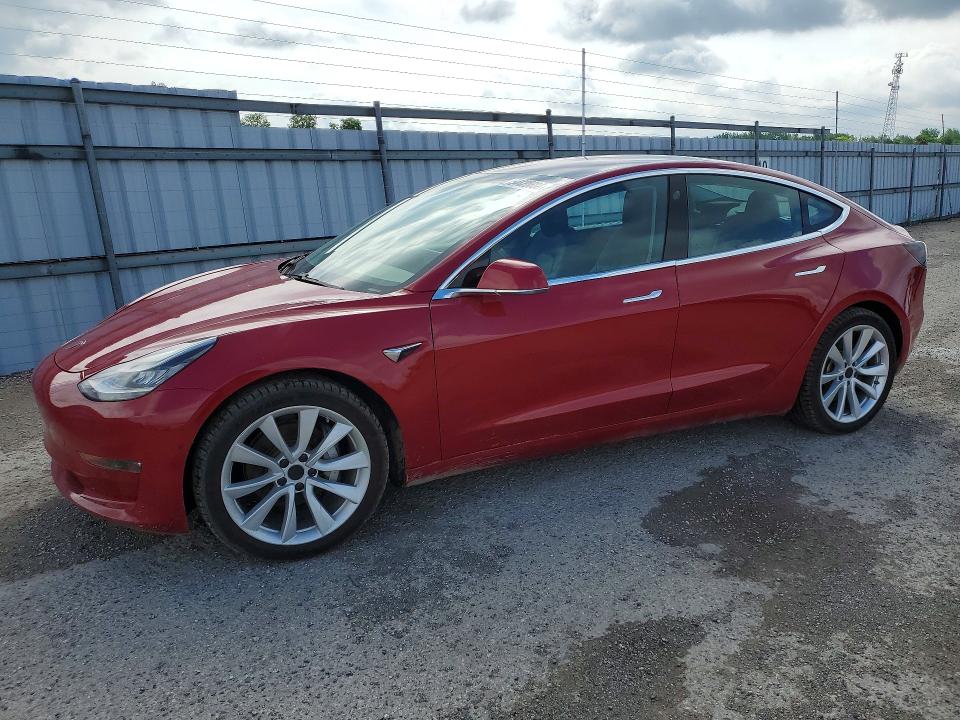 2018 Tesla Model 3 VIN 5YJ3E1EB1JF126997 COPART salvage auction — MINOR DENT/SCRATCHES, On - Permit Rebuilt - Unfit, sold $7,400 on 2026-07-03 (photo 1)