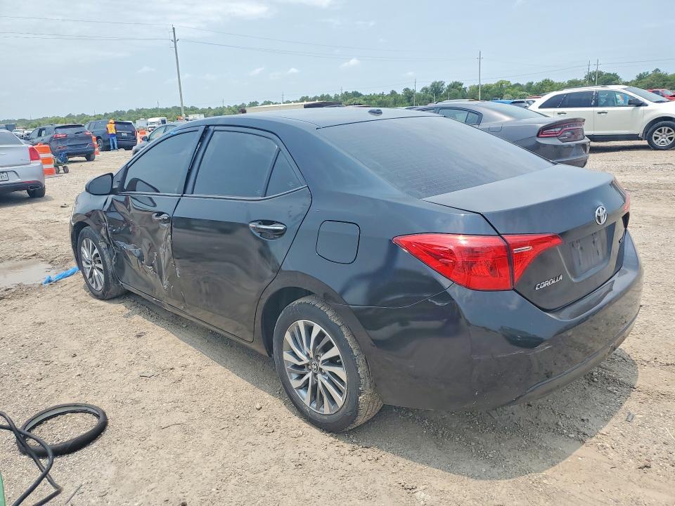 2018 Toyota Corolla VIN 5YFBURHE3JP840962 COPART salvage auction — SIDE, Tx - Salvage Vehicle Title, sold $2,450 on 2026-07-27 (photo 2)