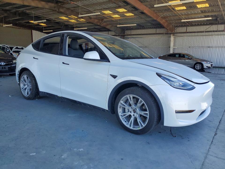 2022 Tesla Model y VIN 7SAYGDEE3NF354195 COPART salvage auction — REAR END, Salvage Title, sold $15,600 on 2026-07-13 (photo 4)