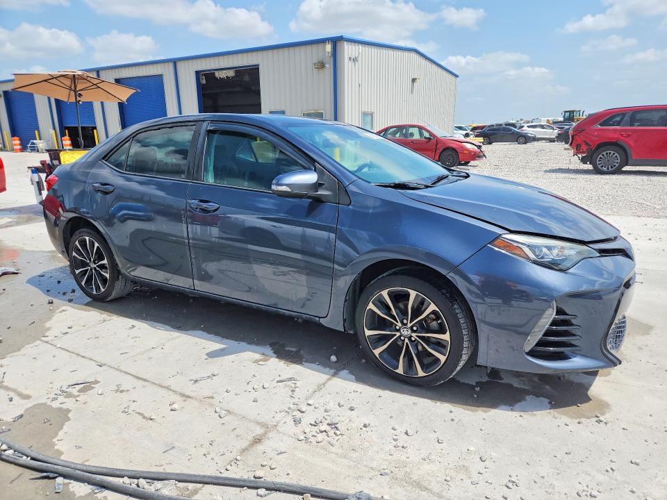 2018 Toyota Corolla VIN 5YFBURHE5JP816565 COPART salvage auction — WATER/FLOOD, TX - SALVAGE TITLE-FLOOD DAMAGE, sold $1,800 on 2026-07-24 (photo 4)
