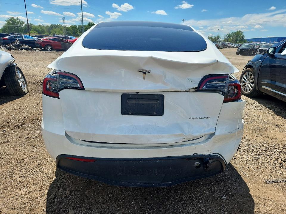 2023 Tesla Model y VIN 7SAYGDEEXPF671829 COPART salvage auction — REAR END, MI - CERTIFICATE OF TITLE, sold $15,600 on 2026-07-10 (photo 6)