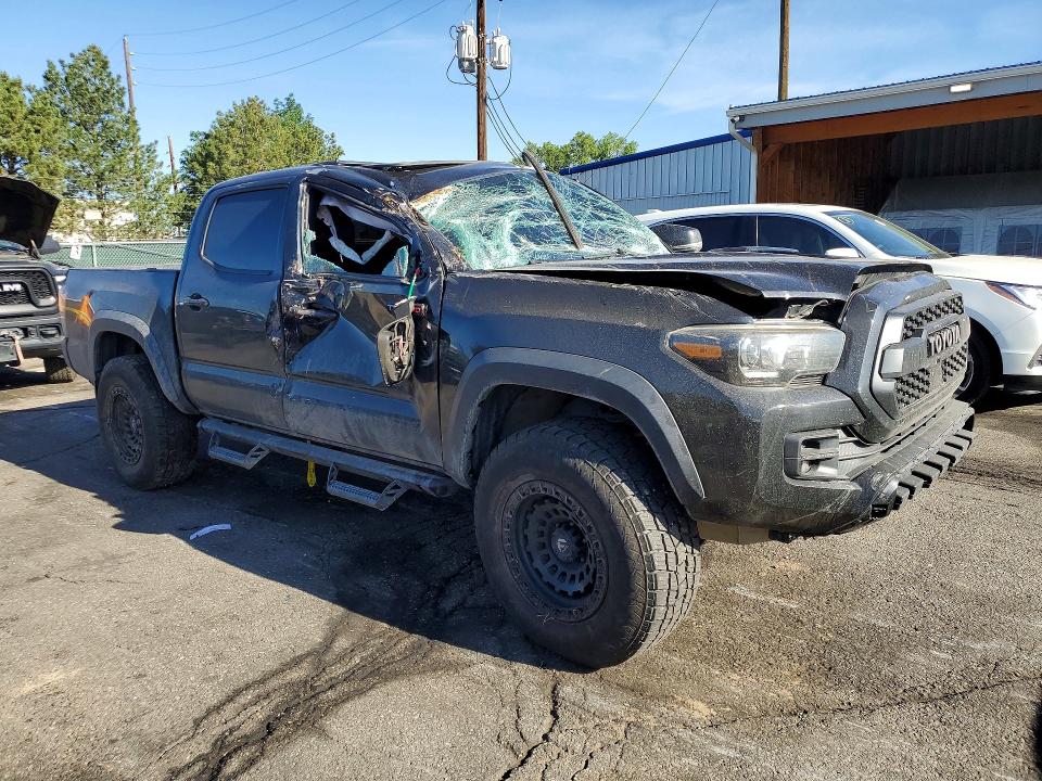 2019 Toyota Tacoma VIN 5TFCZ5AN7KX209708 COPART salvage auction — ROLLOVER, Co - Public - Salvage Title, sold $9,000 on 2026-07-09 (photo 4)
