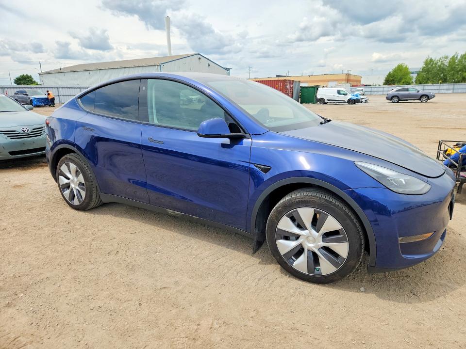 2023 Tesla Model y VIN LRWYGDEE0PC228256 COPART salvage auction — REAR END, ON - PERMIT SALVAGE, sold $10,700 on 2026-07-30 (photo 4)