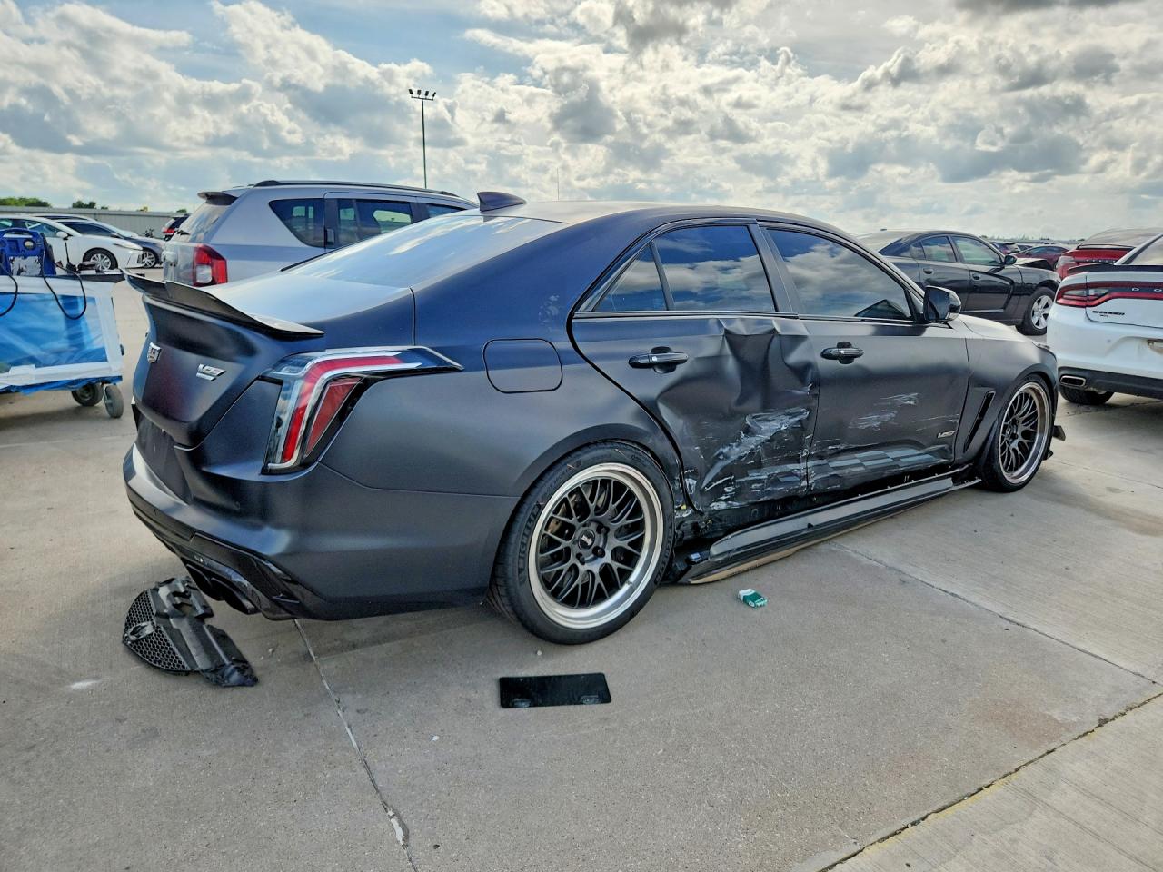 2023 Cadillac VIN 1G6DL5RP8P0566037 COPART salvage auction — Side, TX - SALVAGE VEHICLE TITLE, sold $26,250 on 2026-08-10 (photo 3)