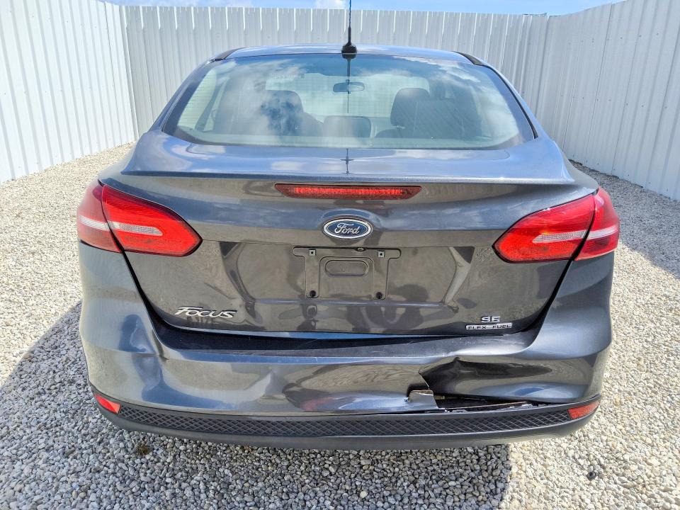 2016 Ford Focus VIN 1FADP3F23GL390825 COPART salvage auction — REAR END, Fl - Certificate Of Title, sold $125 on 2026-07-07 (photo 6)