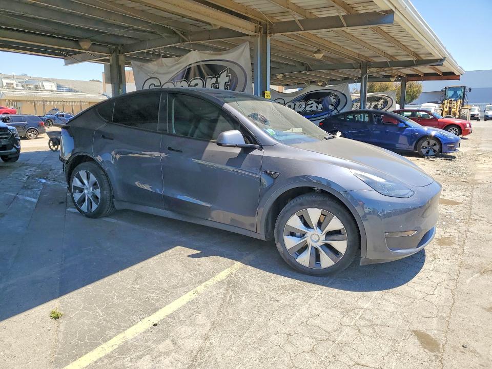 2023 Tesla Model y VIN 7SAYGDEE2PF625377 COPART salvage auction — REAR END, Ca - Salvage Certificate, sold $7,700 on 2026-07-07 (photo 4)