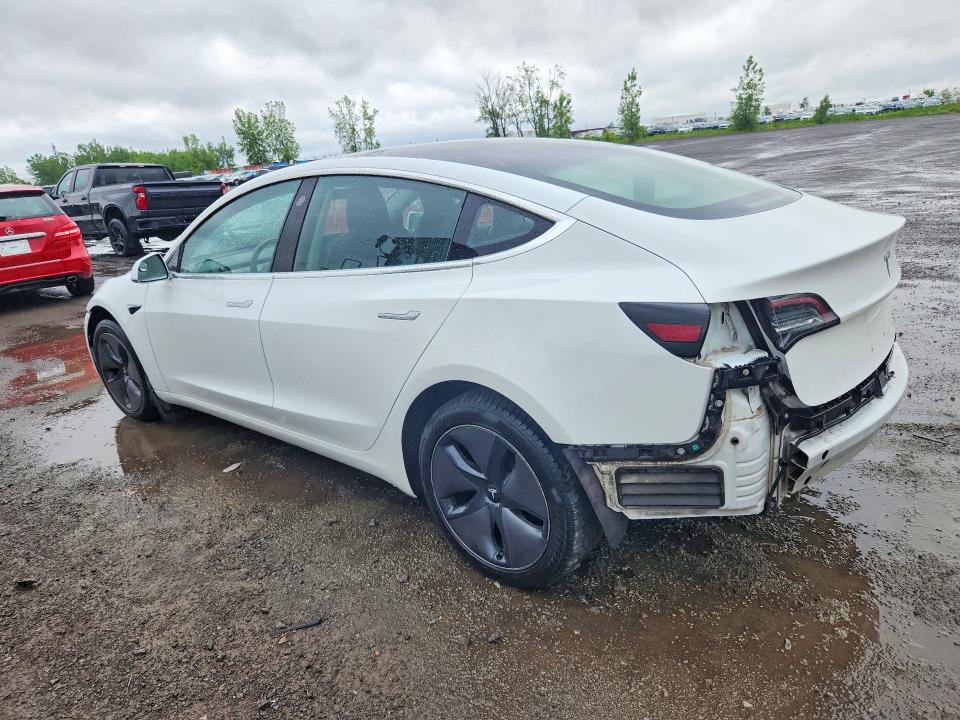 2018 Tesla Model 3 VIN 5YJ3E1EA7JF104008 COPART salvage auction — SIDE, Qc - Gravement Accidente, sold $5,300 on 2026-07-21 (photo 2)