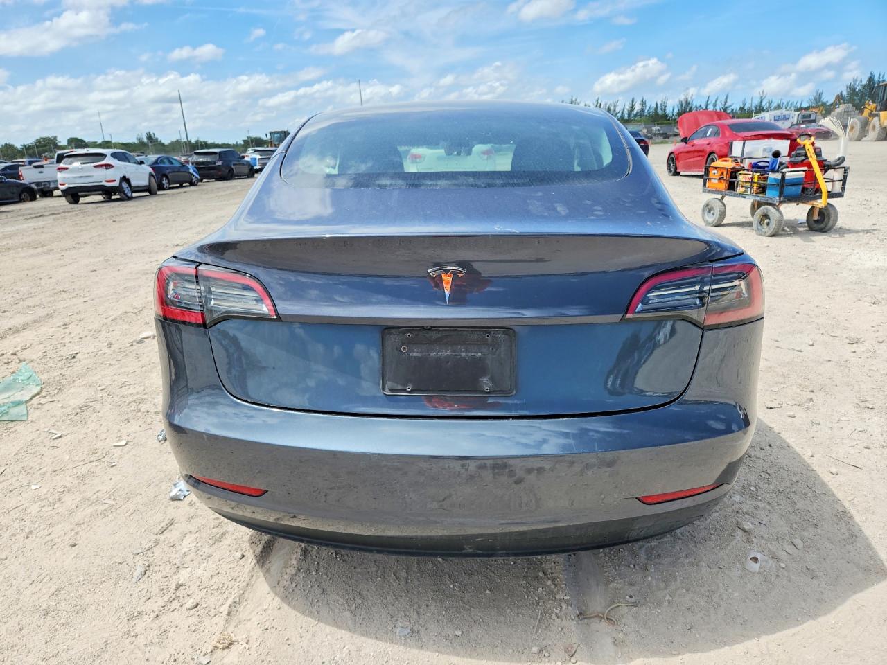 2023 Tesla Model 3 VIN 5YJ3E1EA7PF697474 COPART salvage auction — Side, MD - CERTIFICATE OF TITLE, sold $5,900 on 2026-07-03 (photo 6)