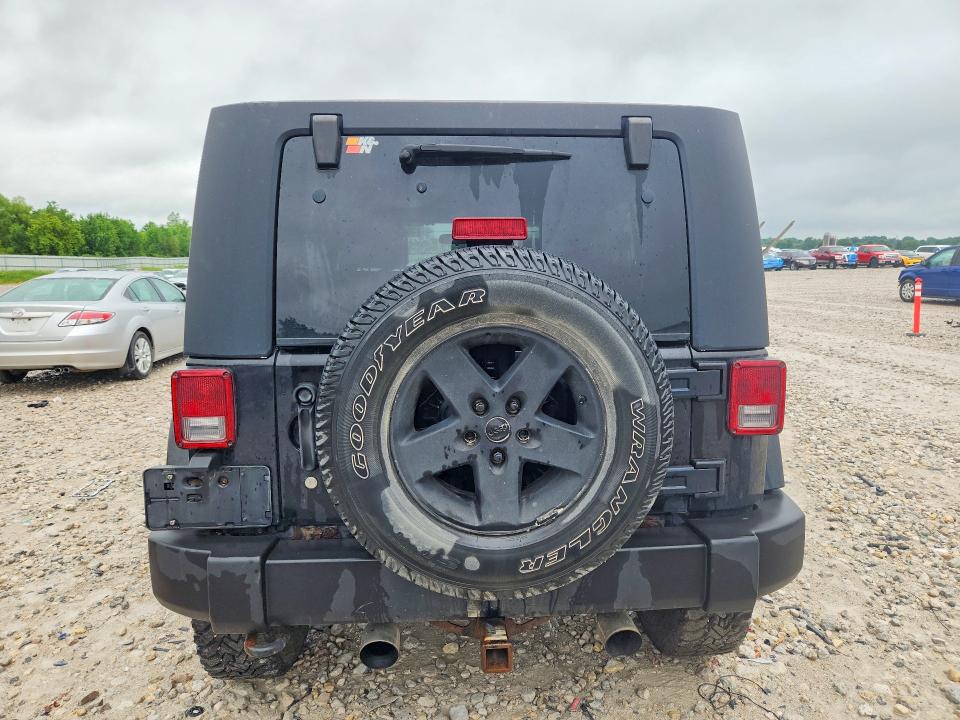 2009 Jeep Wrangler unlimited VIN 1J4GA59129L751093 COPART salvage auction — ENGINE BURN, Mi - Certificate Of Title, sold $725 on 2026-07-09 (photo 6)
