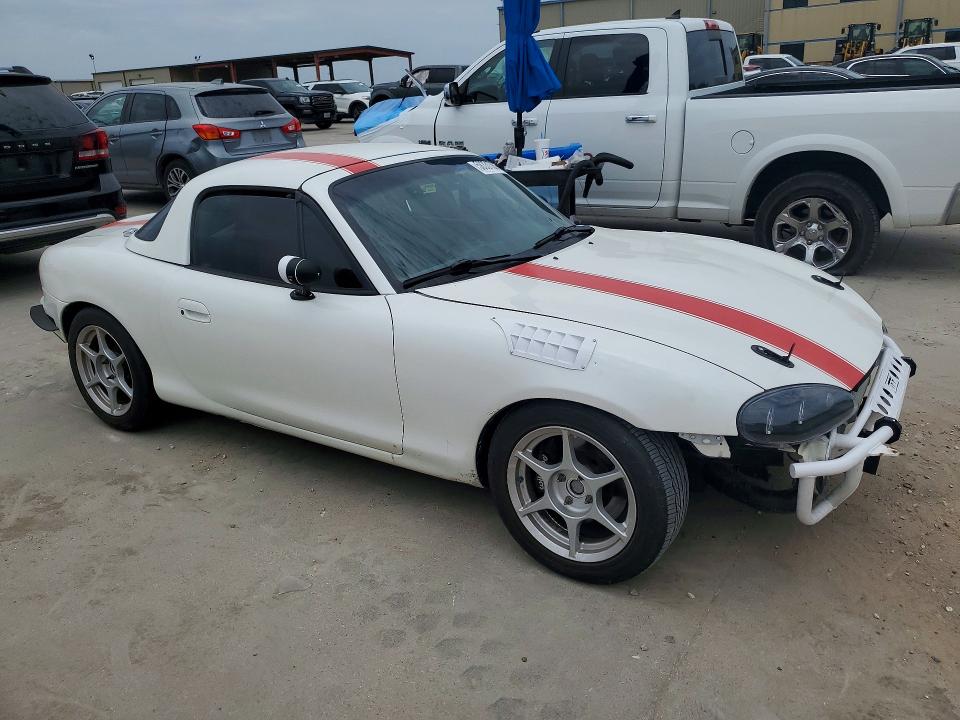 1999 Mazda Mx-5 VIN JM1NB3538X0100989 COPART salvage auction — WATER/FLOOD, Tx - Salvage Title-Flood Damage, sold $5,300 on 2026-07-23 (photo 4)