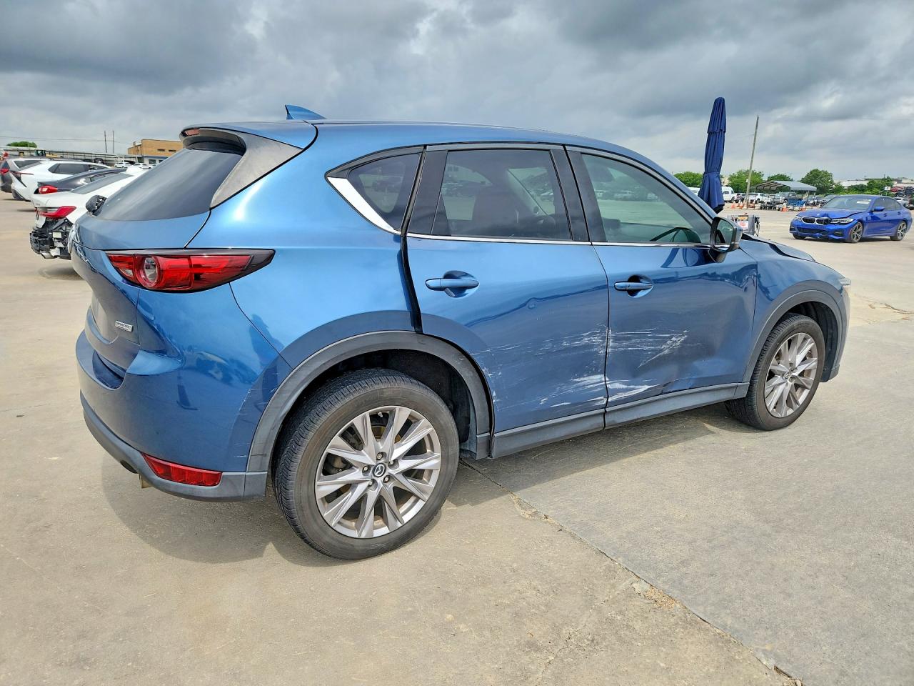 2019 Mazda CX-5 VIN JM3KFADM9K1669737 COPART salvage auction — Side, Sv - Salvage Title, sold $4,750 on 2026-07-09 (photo 3)