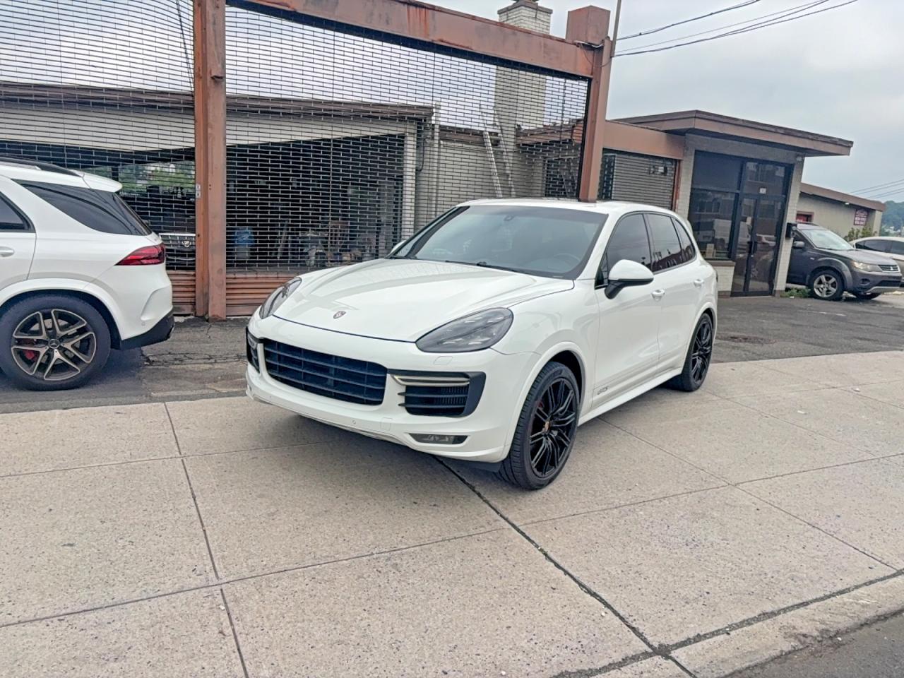 2016 Porsche Cayenne VIN WP1AD2A21GLA79142 COPART salvage auction — Normal Wear, NY - CERT OF TITLE-REBUILT SALVAGE (P), sold $1,500 on 2026-06-30 (photo 2)