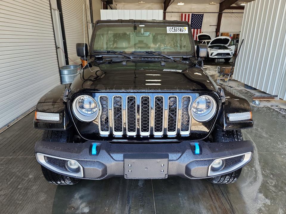 2023 Jeep Wrangler / VIN 1C4JJXP64PW556775 COPART salvage auction — MINOR DENT/SCRATCHES, Mo - Certificate Of Title, sold $22,250 on 2026-07-02 (photo 5)