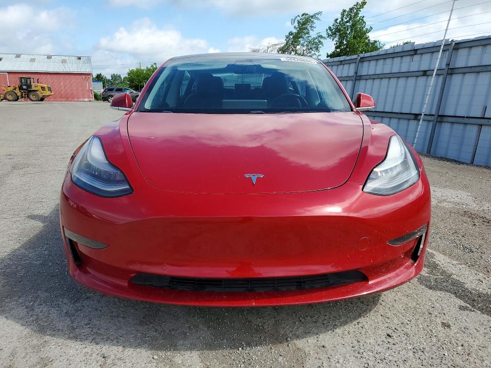 2018 Tesla Model 3 VIN 5YJ3E1EB1JF126997 COPART salvage auction — MINOR DENT/SCRATCHES, On - Permit Rebuilt - Unfit, sold $7,400 on 2026-07-03 (photo 5)