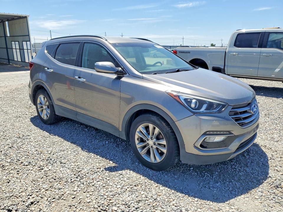 2017 Hyundai Santa fe VIN 5XYZUDLA8HG489910 COPART salvage auction — NORMAL WEAR, MI - DIS/DLR/EXP ONLY CLEAN TITLE, sold $2,650 on 2026-07-09 (photo 4)
