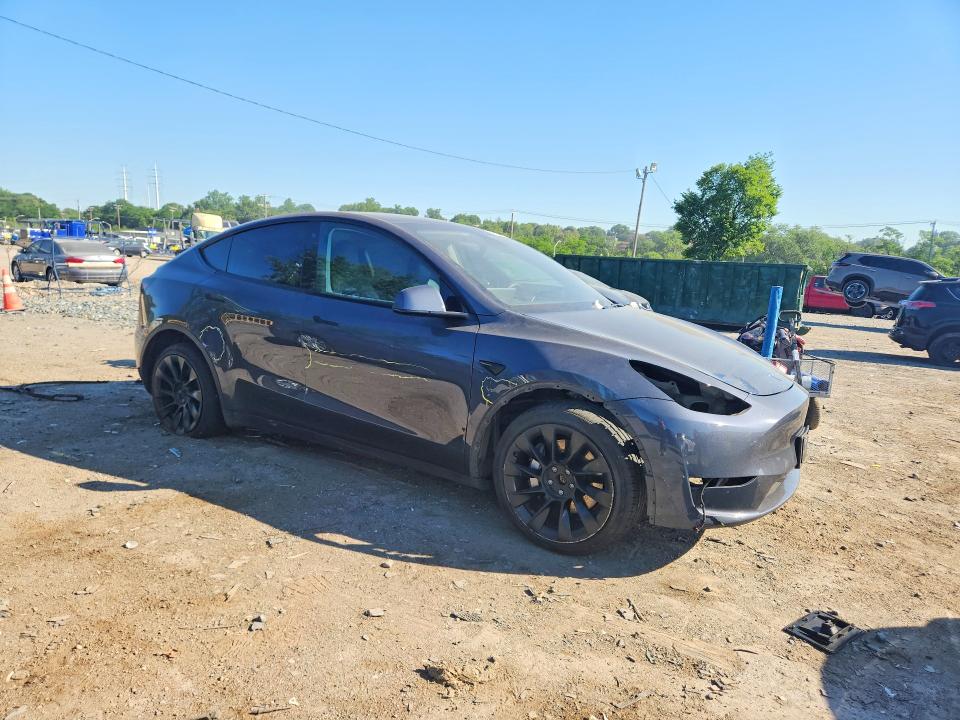 2023 Tesla Model y VIN 7SAYGDEE9PA034654 COPART salvage auction — SIDE, MD - CERT OF SALVAGE < 75% DAMAGE, sold $11,600 on 2026-07-07 (photo 4)