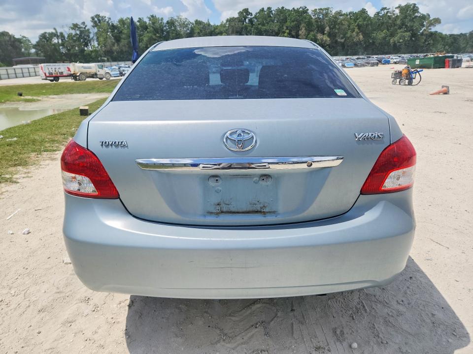 2009 Toyota Yaris VIN JTDBT903991305695 COPART salvage auction — FRONT END, FL - CERT OF TITLE SLVG REBUILDABLE, sold $275 on 2026-07-21 (photo 6)