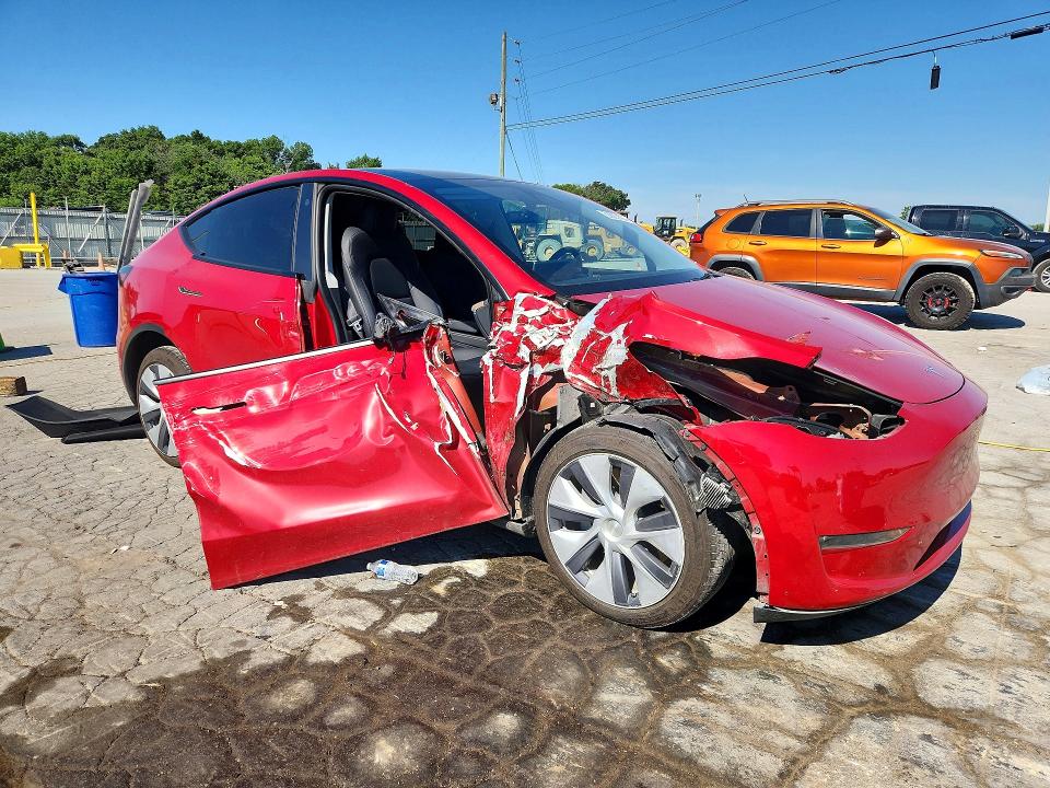 2023 Tesla Model y VIN 7SAYGDEE8PA056449 COPART salvage auction — SIDE, Tn - Salvage Certificate, sold $11,000 on 2026-07-06 (photo 4)
