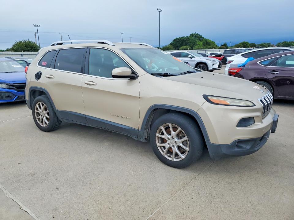 2014 Jeep Cherokee VIN 1C4PJLCS2EW297397 COPART salvage auction — SIDE, Tx - Certificate Of Title, sold $1,100 on 2026-07-09 (photo 4)