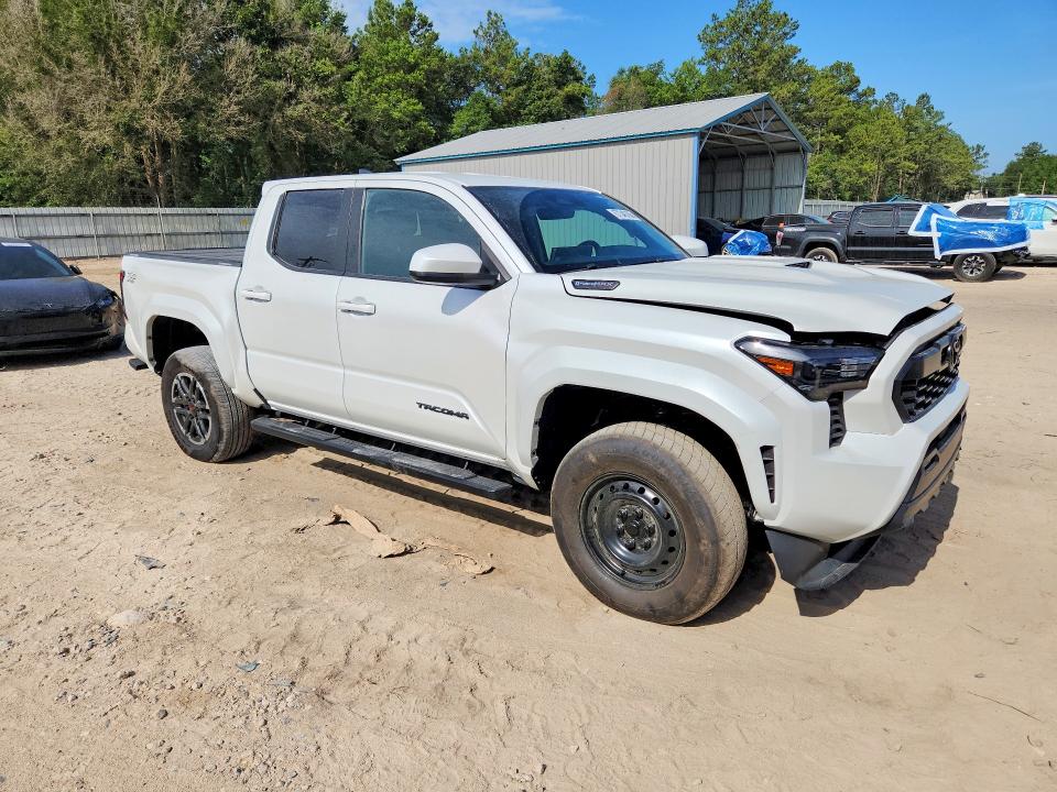 2026 Toyota Tacoma VIN 3TYLC5LN7TT057763 COPART salvage auction — SIDE, Fl - Cert Of Title Slvg Rebuildable, sold $16,700 on 2026-07-31 (photo 4)