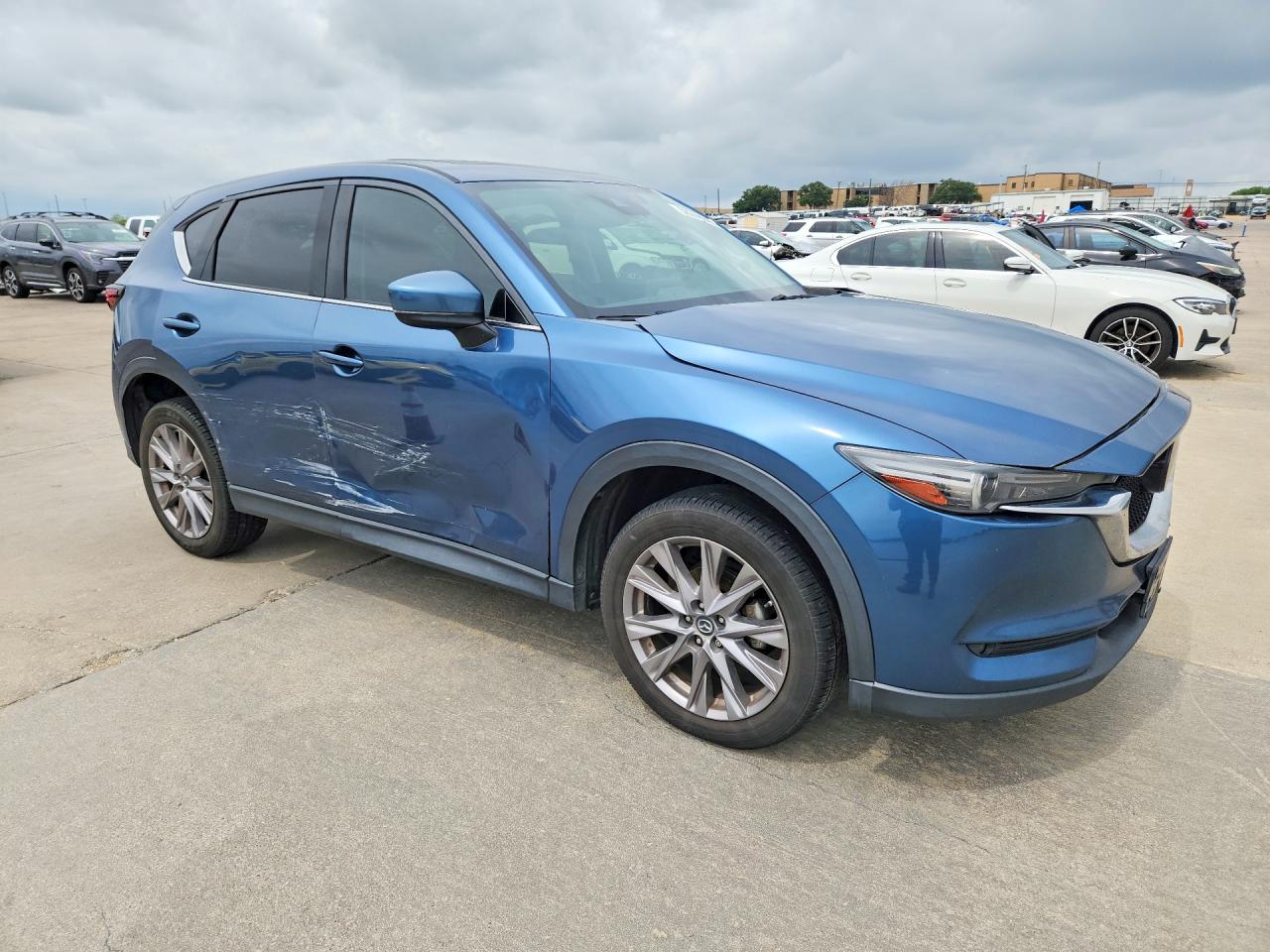 2019 Mazda CX-5 VIN JM3KFADM9K1669737 COPART salvage auction — Side, Sv - Salvage Title, sold $4,750 on 2026-07-09 (photo 4)