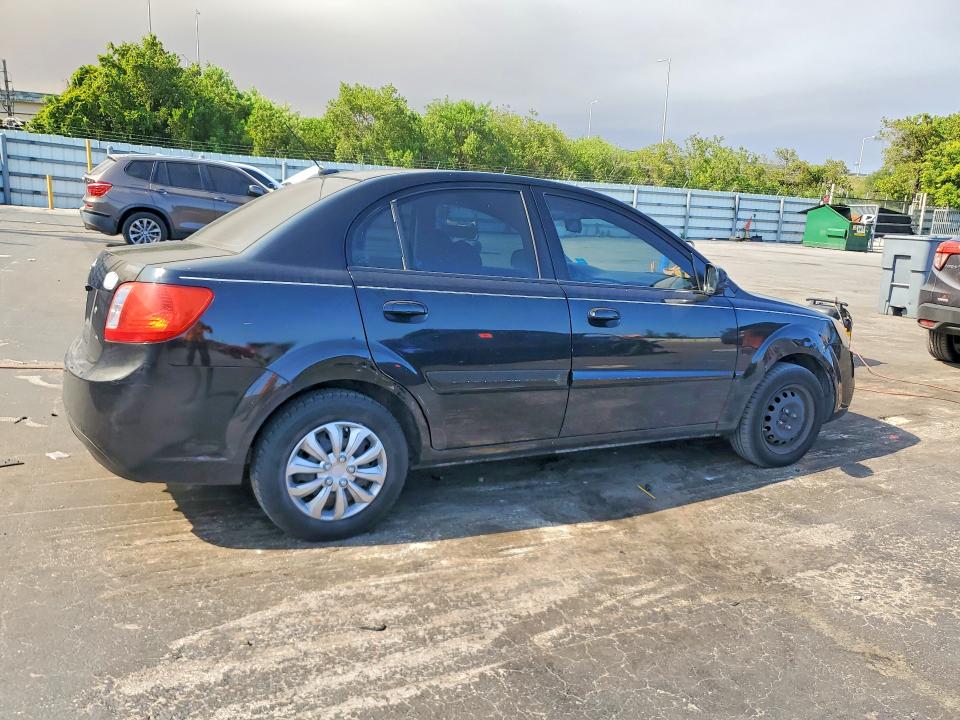 2010 Kia Rio VIN KNADH4A38A6635781 COPART salvage auction — SIDE, Fl - Cert Of Title Slvg Rebuildable, sold $425 on 2026-07-11 (photo 3)