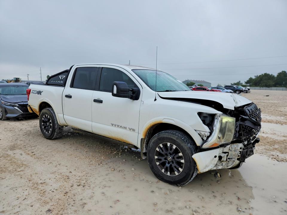 2018 Nissan VIN 1N6AA1E5XJN518825 COPART salvage auction — FRONT END, Tx - Salvage Vehicle Title, sold $4,350 on 2026-07-09 (photo 4)