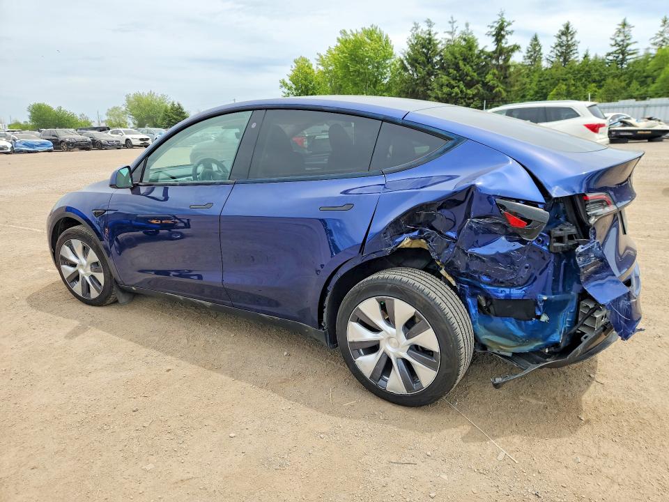 2023 Tesla Model y VIN LRWYGDEE0PC228256 COPART salvage auction — REAR END, ON - PERMIT SALVAGE, sold $10,700 on 2026-07-30 (photo 2)