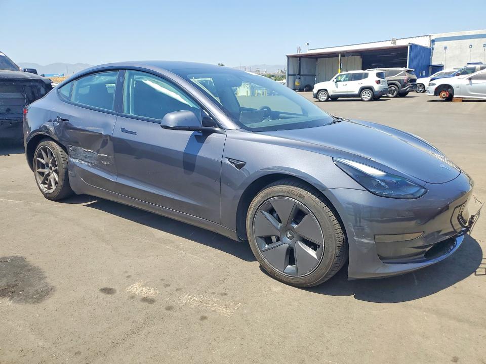 2023 Tesla Model 3 VIN 5YJ3E1EA3PF656579 COPART salvage auction — SIDE, Salvage Title, sold $8,300 on 2026-07-13 (photo 4)