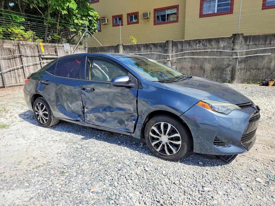 2017 Toyota Corolla VIN 5YFBURHE9HP703339 COPART salvage auction — SIDE, Fl - Cert Of Title Slvg Rebuildable, sold $3,750 on 2026-07-10 (photo 4)
