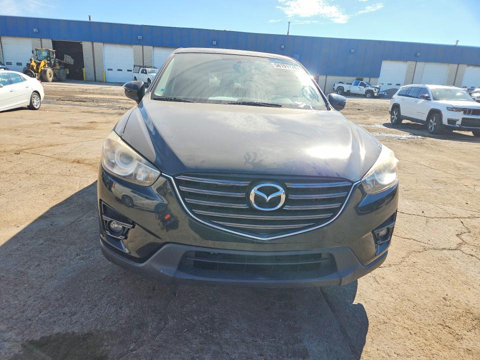 2016 Mazda Cx-5 VIN JM3KE4CY4G0770156 COPART salvage auction — SIDE, MI - DEALER ONLY CLEAN TITLE, sold $1,700 on 2026-07-02 (photo 5)