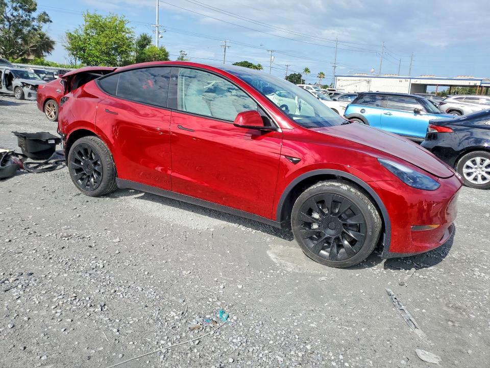 2025 Tesla Model y VIN 7SAYGDEE6SA352627 COPART salvage auction — REAR END, Fl - Cert Of Title Slvg Rebuildable, sold $14,300 on 2026-07-06 (photo 4)