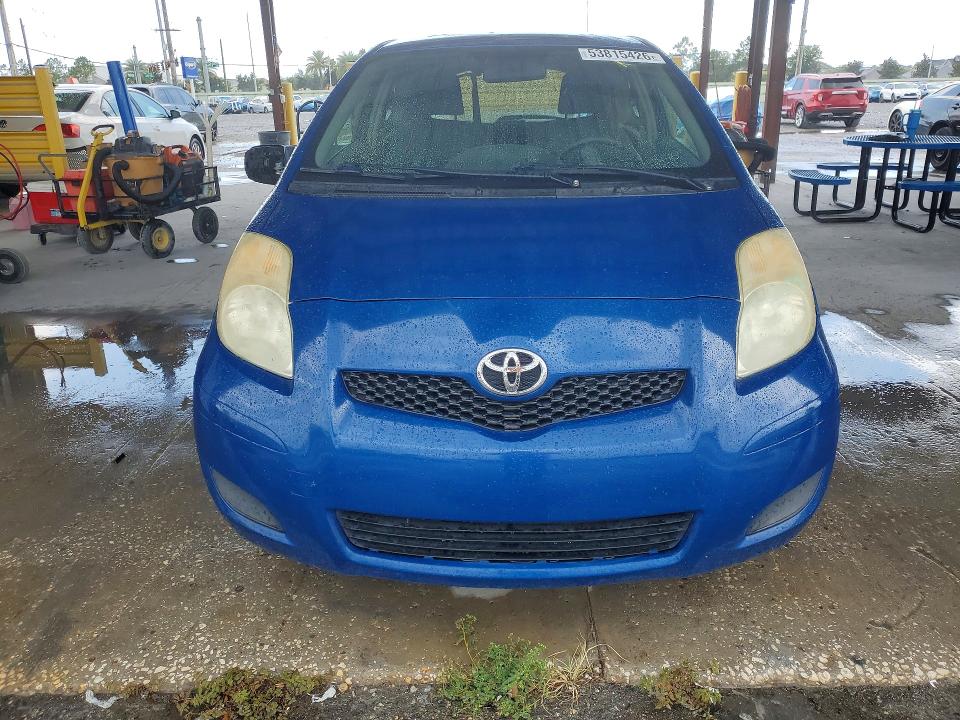 2010 Toyota Yaris VIN JTDJT4K33A5288689 COPART salvage auction — SIDE, Fl - Cert Of Title Slvg Rebuildable, sold $850 on 2026-07-06 (photo 5)