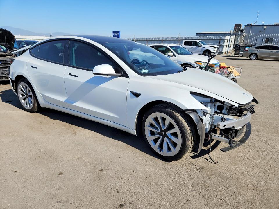 2023 Tesla Model 3 VIN 5YJ3E1EA6PF583983 COPART salvage auction — REAR END, CA - SALVAGE CERTIFICATE, sold $225 on 2026-07-24 (photo 4)