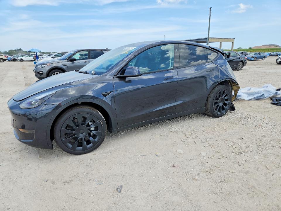 2024 Tesla Model y VIN 7SAYGDEDXRF050990 COPART salvage auction — REAR END, Fl - Cert Of Title Slvg Rebuildable, sold $8,600 on 2026-07-09 (photo 1)