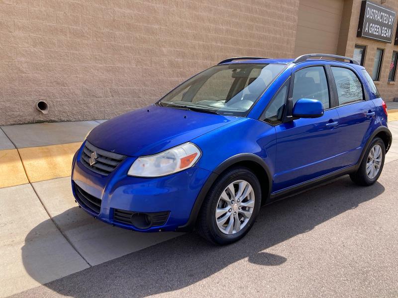 2013 Suzuki Sx4 VIN JS2YB5A31D6101902 COPART salvage auction — DAMAGE HISTORY, Co - Dlr/Dis/Exp-Ct Others-Ca Acq (P), sold $450 on 2026-07-09 (photo 2)