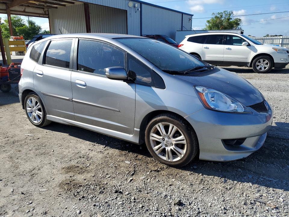 2010 Honda Fit VIN JHMGE8H46AC022573 COPART salvage auction — WATER/FLOOD, FL - CERT OF TITLE-SLVG REBLD FLOOD, sold $150 on 2026-07-21 (photo 4)