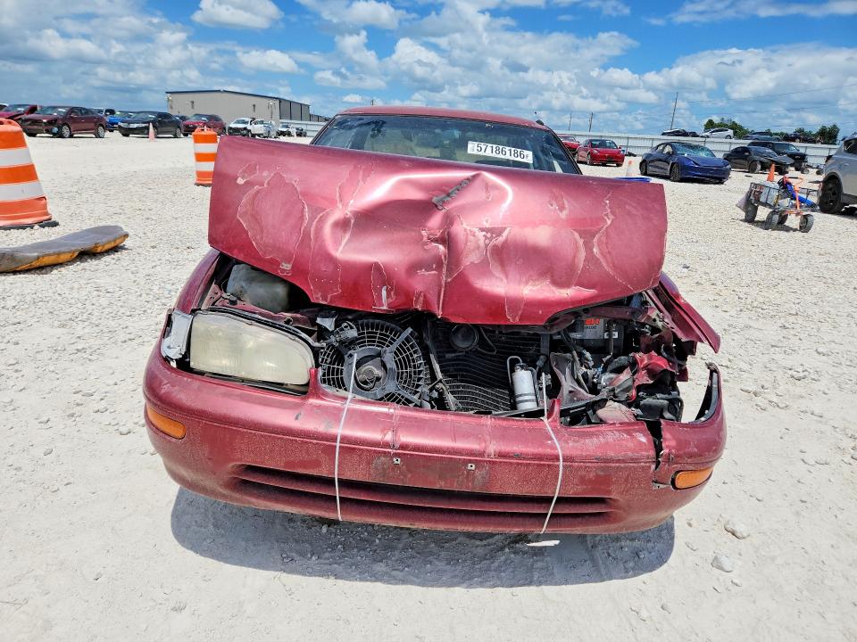 1995 Geo Prizm VIN 1Y1SK5281SZ060656 COPART salvage auction — FRONT END, TX - SALVAGE VEHICLE TITLE (P), sold $70 on 2026-07-16 (photo 5)