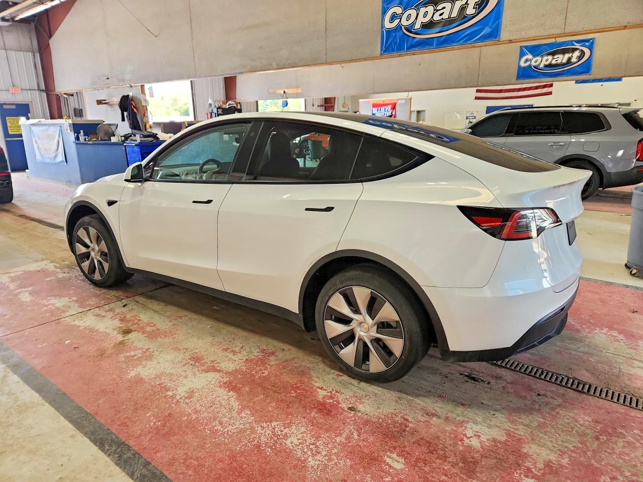 2023 Tesla Model Y VIN 7SAYGDEE7PF606971 COPART salvage auction — Rear End, NY - MV-907A SALVAGE CERTIFICATE, sold $8,900 on 2026-07-06 (photo 2)