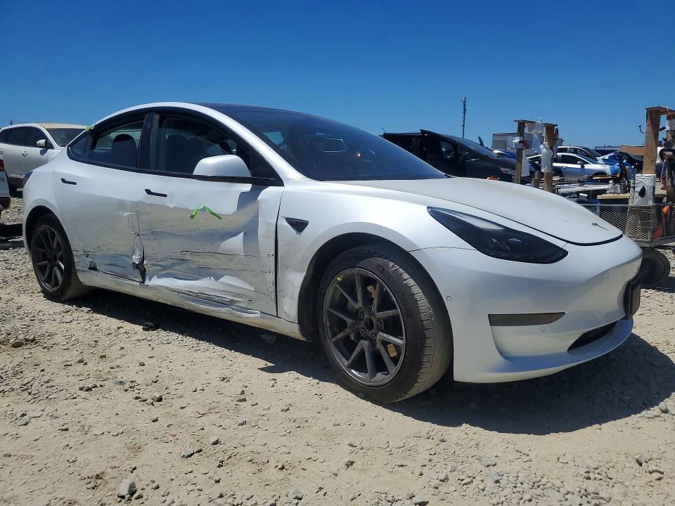 2021 Tesla Model 3 VIN 5YJ3E1EA9MF876949 COPART salvage auction — SIDE, CA - SALVAGE CERTIFICATE, sold $7,800 on 2026-07-16 (photo 4)